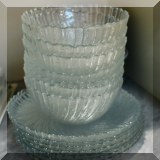 K26. Set of glass bowls and plates.